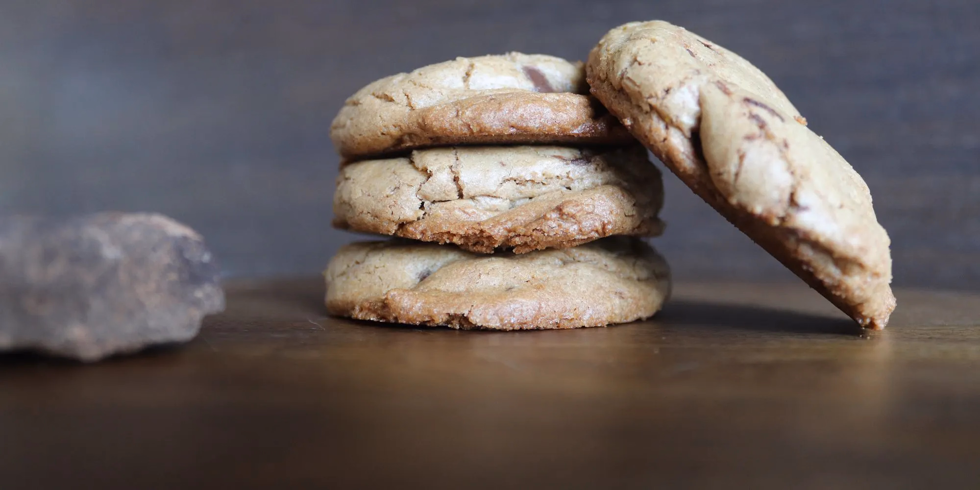 A stack of brown butter chocolate chip cookies cooling